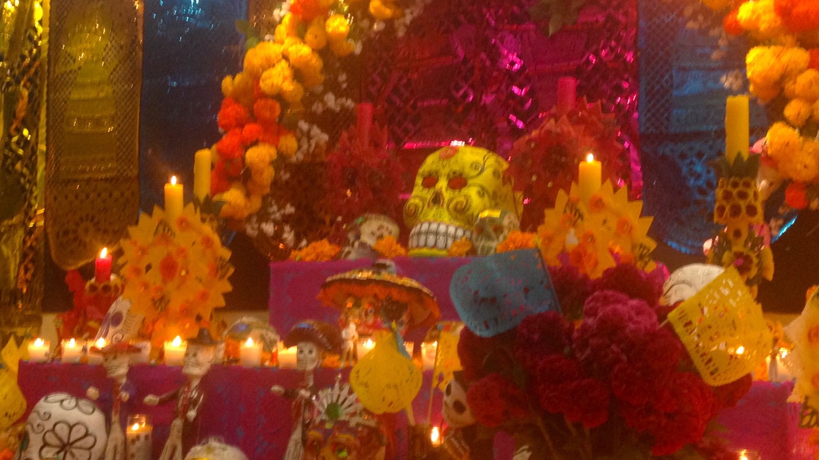 Day of the Dead ofrenda with candles and marigolds