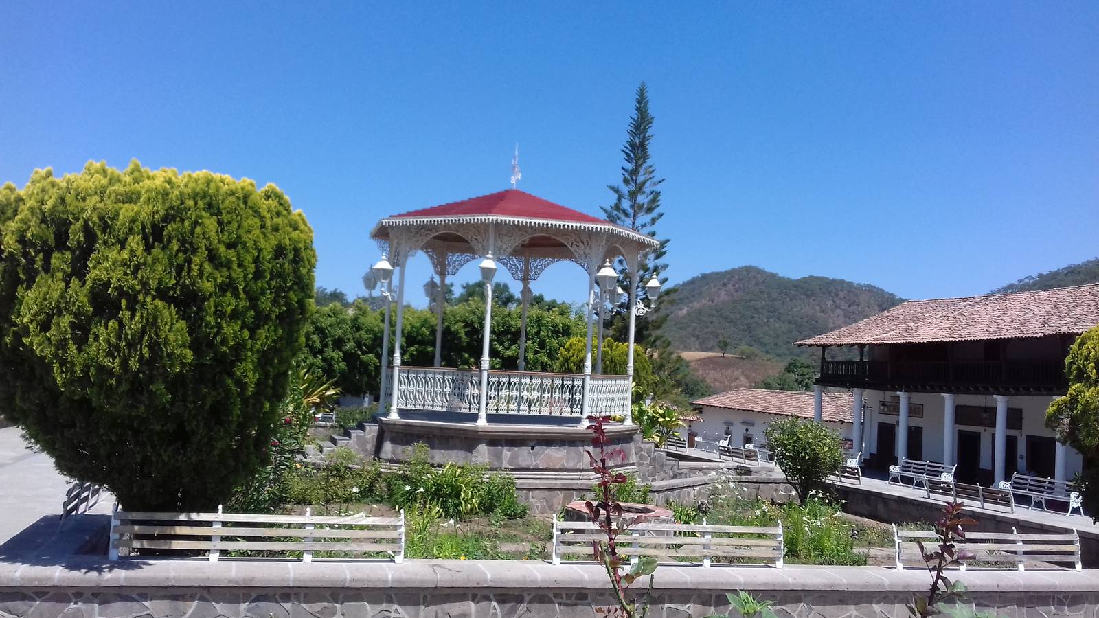 The bandstand and colonnaded buildings on the main square of San Sebastián del Oeste